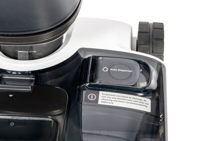 Der Reinigungsmitteltank mit Hinweisschild